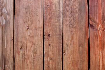 The texture of a wooden panel painted brown.