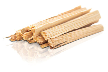 A pile of firewood laid out by a hill. Isolated on transparent background.