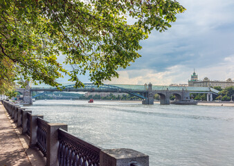 View of the Moscow river embakment, Pushkinsky bridge and cruise ships at sunset.