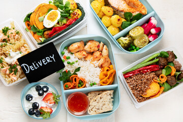 Restaurant healthy food delivery in take away boxes for daily nutrition on white background.