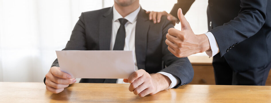 Congratulating, confidence two colleague asian businessman, male encourage staff for done excellent work. Boss showing thumbs up to do very good job. Leadership of team support. Trust of supervisor.