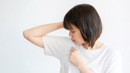 Woman sweating under armpit because of hot weather.