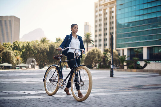Travel, city and businesswoman walking with a bicycle in the morning in the street to work. Eco friendly, transport and professional female employee commuting to the office with a bike Generative AI