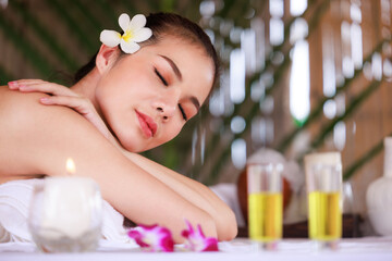 Obraz na płótnie Canvas woman having massage in the spa salon, beauty, health care body skin natural herbs and essential oils treatment. concept,