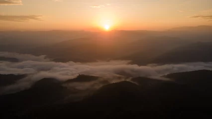 Foto op Plexiglas Mistige ochtendstond Sunrise landscape under the beautiful cloud valley as the mist moves around the hill
