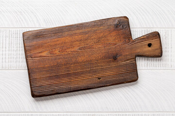 Wooden cutting board on kitchen table