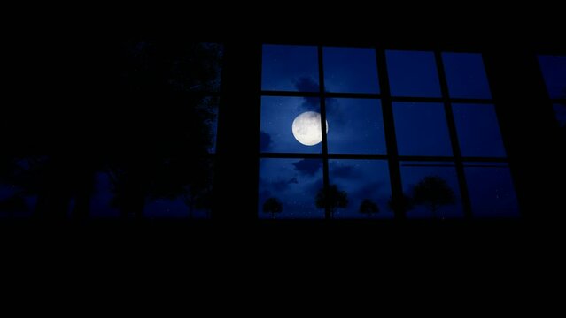 Time-lapse photography of the moon rising outside the window of the old house at night