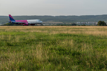 Arriving plane at the airport in the middle of the tourist season.