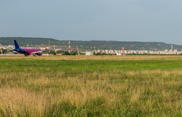 Arriving plane at the airport in the middle of the summer season.