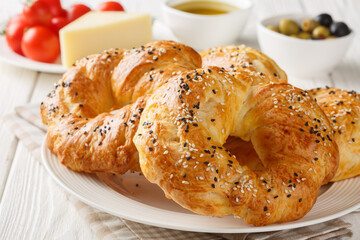 Turkish savory pastry Acma similar to a bagel close-up in a bowl on the table. Horizontal