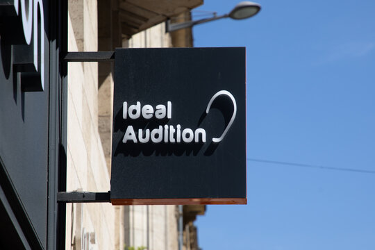 ideal audition logo brand and text sign shop medical agency store hear system aid medical