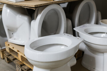 Lot of white toilets in hardware store, plumbing department