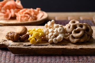 Various edible mushroom on wooden, healthy food ingredient