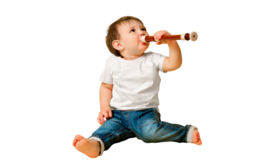 Toddler baby with a flute wind musical instrument on a studio isolated on a white background. A happy child musician holds a block flute, copy space. Kid is a boy aged one year four months