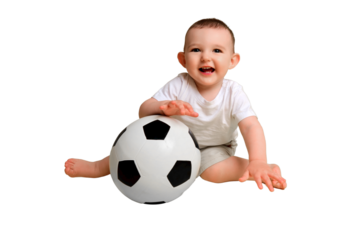 Happy baby boy plays with a soccer ball, isolated on a white background. A smiling child learns to play football with a big ball, isolated on a white background. Kid age one year