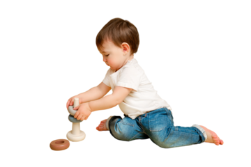 Toddler baby is playing logic educational games with a pyramid on a studio isolated on a white background. Happy child playing with a pyramid educational toy. Kid aged one year four months