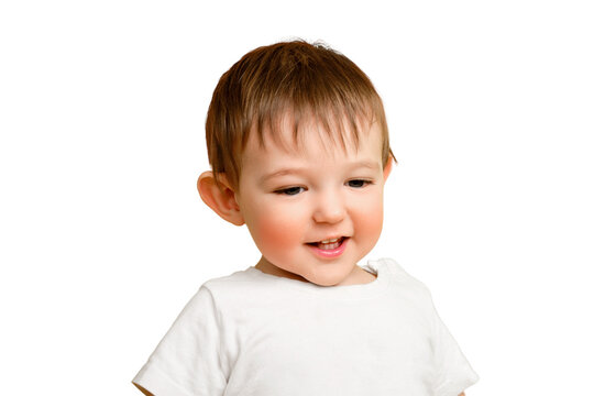 Portrait of a happy toddler baby on a studio isolated on a white background. Smiling child in a white t-shirt, copy space. Kid aged one year and four months