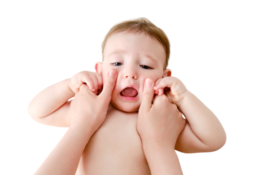 The mother smears the face of the toddler baby boy with cosmetic cream, isolated on a white background. Mom hands apply cream to the child skin, isolated on a white background. Kid aged one year