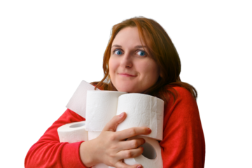 Happy woman's face with toilet paper rolls, white brick wall background, isolated on a white background. Panic with buying toilet paper in crisis due to coronavirus quarantine