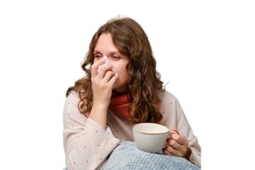 A sick woman blows her nose into a napkin with a cup in her hand, a runny nose, isolated on a white background. Adult ill woman with a red scarf, female aged 35 years