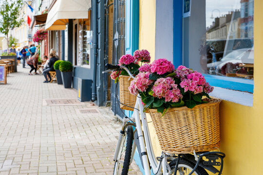 Awesome and colorful streets of Clifden, Connemara, Ireland. Colourful houses, windows with flowers.