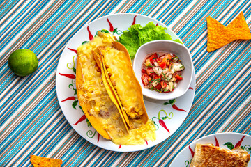 Traditional mexican food. Two tacos with corn, chicken and cheese. Colorful Food Table Celebration Delicious Party Meal Concept. 