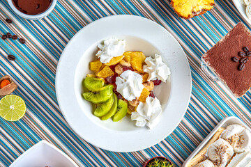 Traditional mexican food. Dessert ice cream, fruit salad. Colorful Food Table Celebration Delicious Party Meal Concept. 
