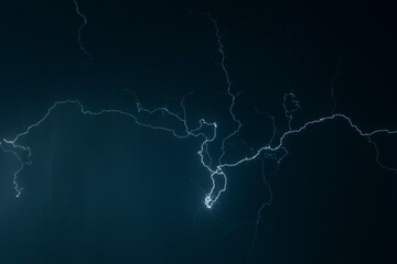 Beautiful Lightning Strikes and Clouds at Night in Lugano, Ticino, Switzerland.