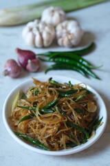 soy sauce seasoned vermicelli noodles with sliced green chilies. Vermicelli are fine noodles made...