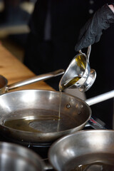 Pouring vegetable oil into frying pan