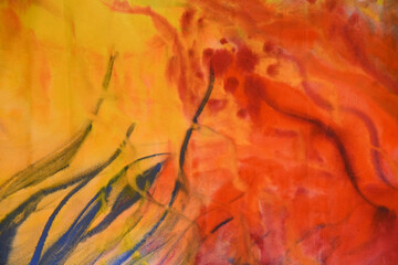 Artistic abstract texture. Yellow and orange stain with blue strokes, light orange tone background