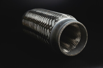 Close-up Selective focus picture with noise effect of exhaust pipe flexible connector.