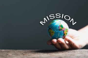 Globe with Holy Bible for mission, Mission christian idea. bible and book on wooden table,...