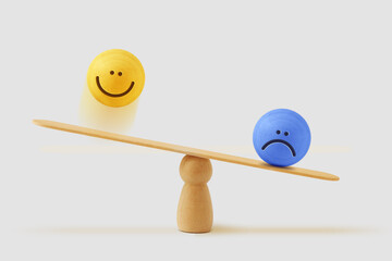 Balance scale with happy and sad face - Concept of sadness and mental illness