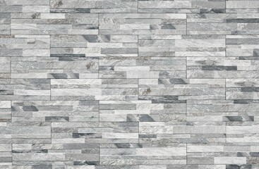 Stoneware paneling wall with stone effect. Colors are shades of gray and black. Exterior home decor, background and texture.