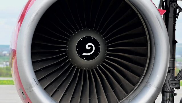 Huge airplane jet engine close up view moving forward heat haze distant airplane lining up behind. 4k super slow motion raw video 120 fps Generative AI