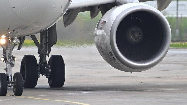 Huge airplane jet engine close up view moving forward heat haze distant airplane lining up behind. 4k super slow motion raw video 120 fps Generative AI