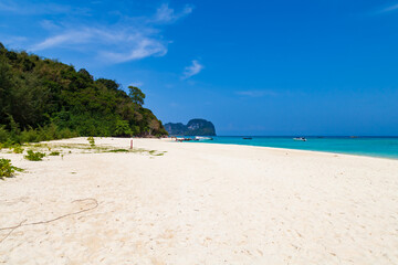 A small Bamboo island in the Andaman Sea with coral reefs, clear water and soft clean sand. Traveling with excursions in Thailand, Phuket. Snorkeling spots.