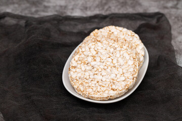 Few crunchy rice cakes on white dish