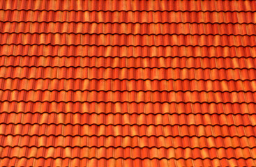 Orange Roof tiles have a seamless texture and roof pattern. The concept for the roof housetop icon with brown roofing tiles. banner texture for roofers.
