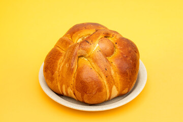 Fresh portuguese Easter folar with egg on dish