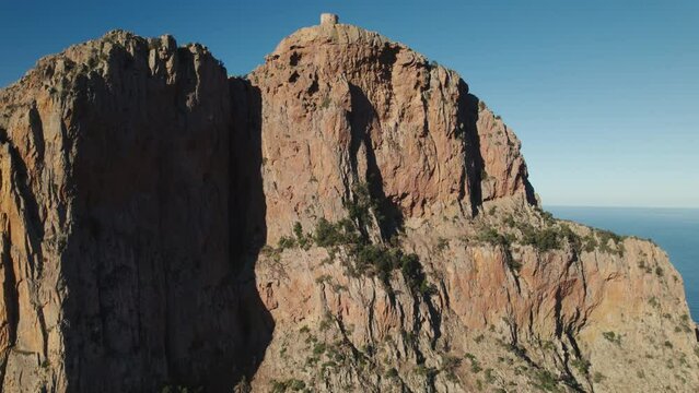 Aerial shot of the Genoese tower at Capo Rosso (Capu Rossu) in Corsica with a 4K drone