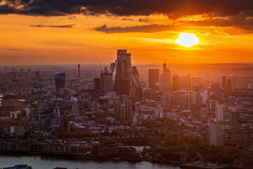 Elevated, panoramic view of the skyine at the City of London, England, during a golden sunset