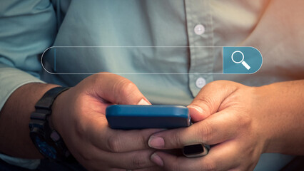 Man using a mobile phone in the room for searching browsing internet data information. Business concept for Using search with your website.