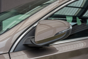 Fototapeta premium Folded side view car mirror placed on the exterior