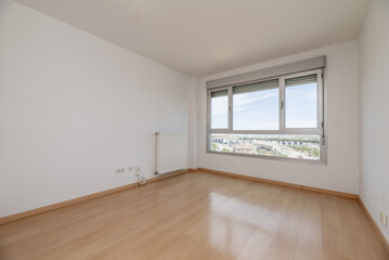 An empty room with a large window