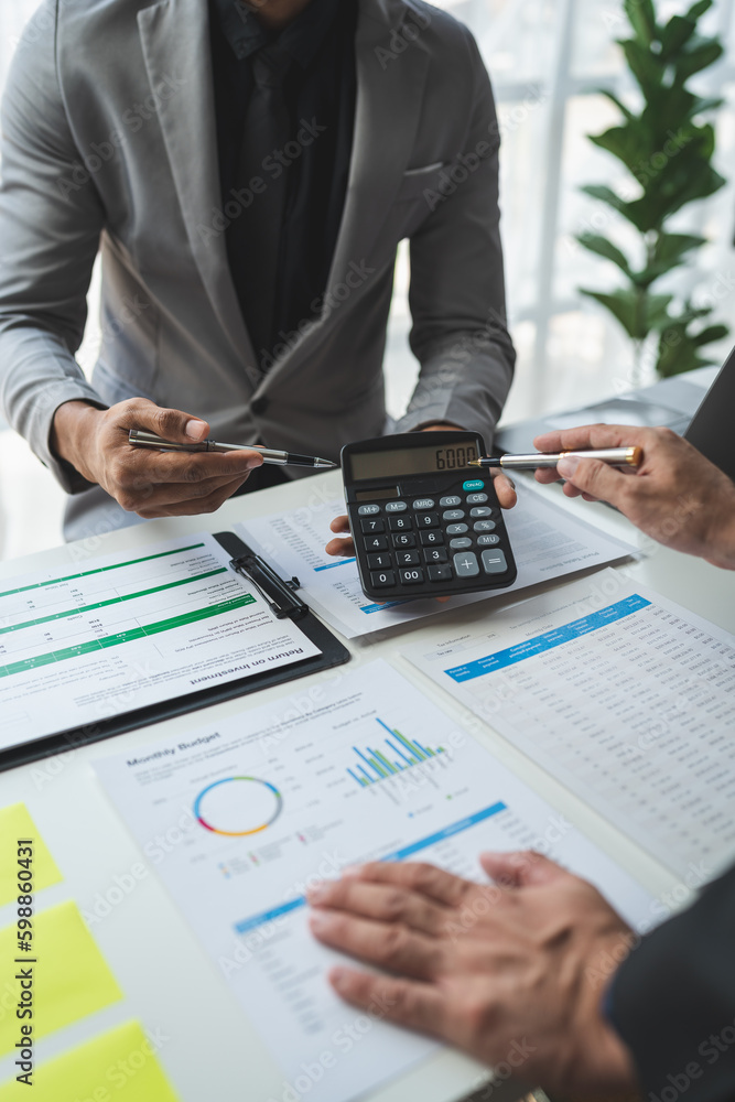 Poster businessman using calculator to calculate company financial statements with colleagues have an analy