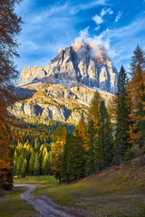 View of Tofane mountains seen from Falzarego pass in an autumn landscape in Dolomites, Italy.