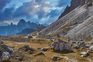 Mountain path Tre Cime National Park on autumn day, Dolomites Mountains, Italy
