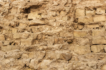 Background a wall of masonry sand-colored bricks